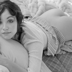 Semi nude model, Christelle, on bed in Oakland studio, b&w photo © Craig Morey 2007